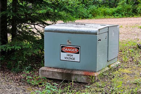 what are those big green electrical boxes called|green electricity box outside house.